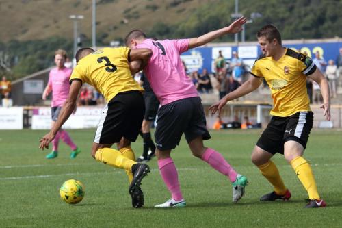 Folkestones Nat Blanks (L) and Callum Davies and Enfields Liam Hope