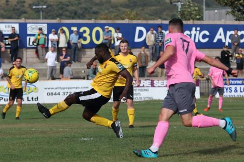 Jerald Aboagye stops the ball reaching Enfields Brandon Adams (17)