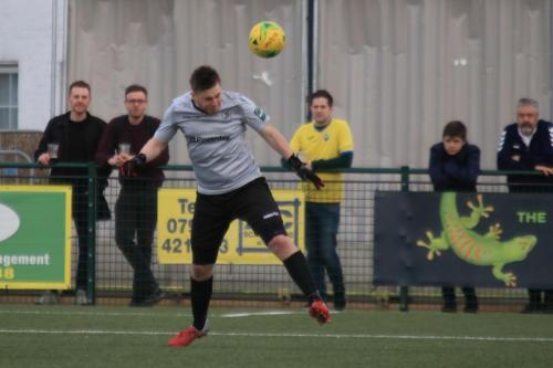 Enfield keeper Matt Nolan heads clear
