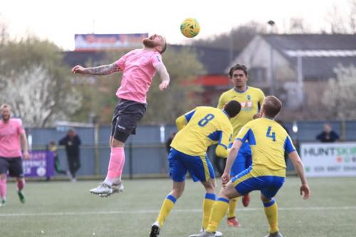 Enfields Billy Bricknell (pink) heads the ball past Gergios Aresti (8), Scott Mitchell (4) and Coby Rowe