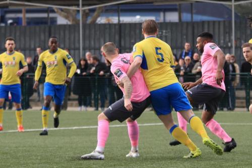 Enfields Billy Bricknell (pink, L) and Kezie Ibe and Haringeys Mark Kirby