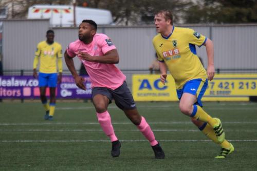 Enfields Kezie Ibe (L) and Haringeys Mark Kirby