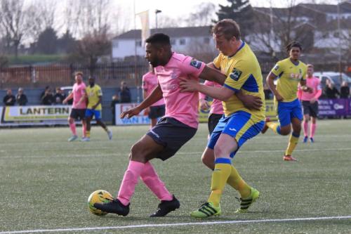 Enfields Kezie Ibe (L) and Haringeys Mark Kirbyx