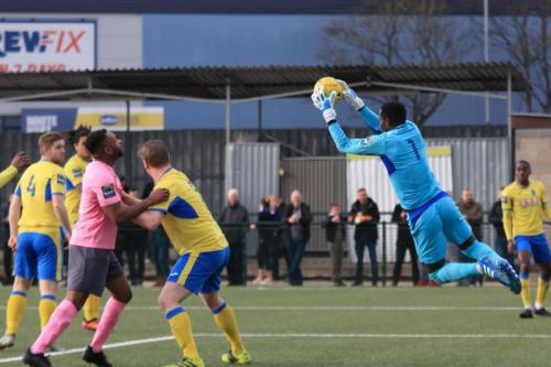 Haringey keeper Valery Pajetat collects a cross from the Enfield left