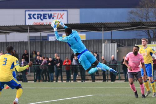 Haringey keeper Valery Pajetat cuts out a cross