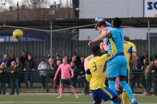 Haringey keeper Valery Pajetat puches clear from Josh Davison