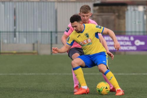 Haringeys Lyle Della Verde (yellow) and Enfields Joe Payne
