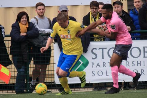 Haringeys Mark Kirby (L) and Enfields Kezie Ibe