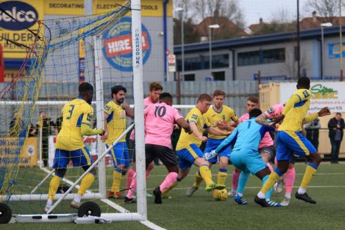 Haringeys Mark Kirby half clears the ball  Everyone then clears the six-yard box and the ball is fired back through the crowd to give Enfield the lead