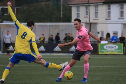 Haringeys  Georgios Aresti (L) and Enfields Matt Johnson