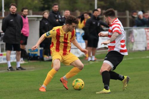 Enfields Bilal Sayoud (L) and Kingstonians Aaron Lamont