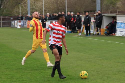 Enfields Billy Bricknell (L) and Kingstonians Jonathan Muleba
