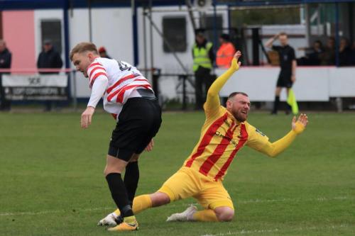 Enfields Billy Bricknell appelas unsuccessfully for a foul as James Richmond clears