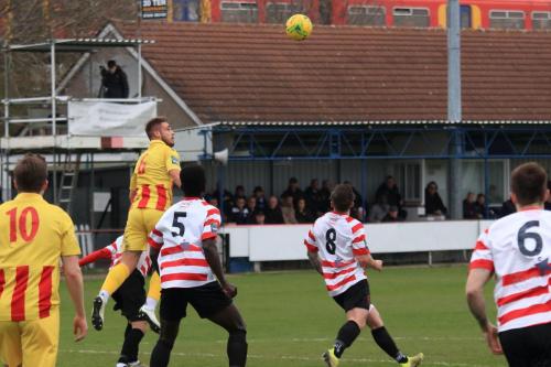 Enfields Dan Rumens (yellow) wins a header
