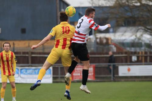 Enfields Josh Davison (L) challenges James OHalloran