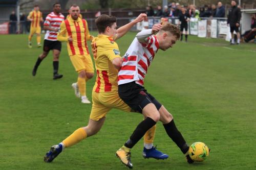 Enfields Josh Davison (L) challenges James Richmond
