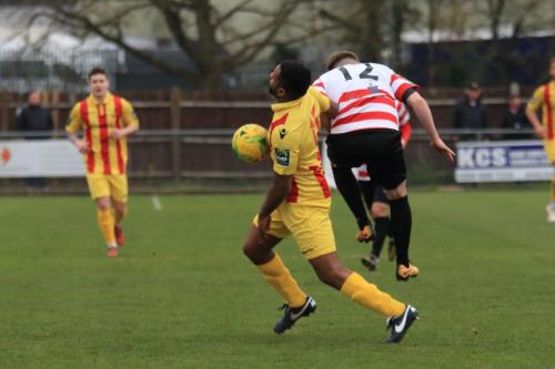 Enfields Kezie Ibe (yellow) and Kingstonians Tom Bird