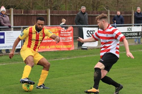 Enfields Kezie Ibe (yellow) and Kingstonians Tom Birdx
