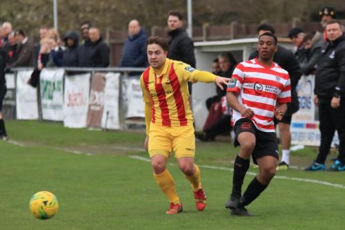 Enfields Lewis Taaffe (L) and Kingstonians Jonathan Muleba