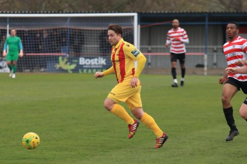 Enfields Lewis Taaffe (L) and Kingstonians Jonathan Mulebax