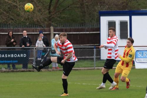 Enfields Lewis Taaffe (R) shoots over the bar