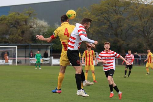 Enfields Matt Johnson (yellow) challenges James OHalloran