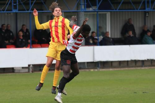 Enfields Sam Youngs (L) and Kingstonians Ismail Yakubu