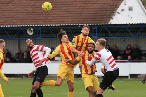 Enfields Sam Youngs (yellow, L), Dan Rumens and Kezie Ibe and Kingstonians Delano Sam-Yorke (L) and James Richmond