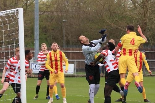 Kingstonian keeper Rob Tolfrey and defender Ismail Yakubu combine to block a header from Matt Johnson (4)