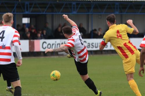 Kingstonians Aaron Lamont (centre) and James Richmond and Enfields Matt Johnson