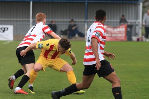 Kingstonians Alfie Egan (L) and Jonathan Muleba and Enfields Jay Porter