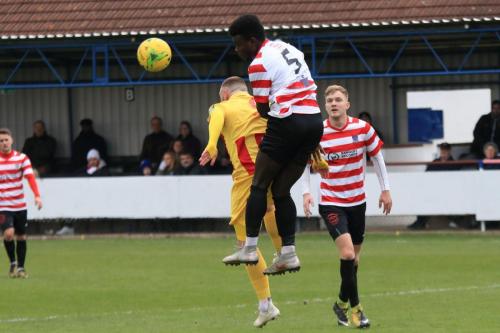 Kingstonians Ismail Yakubu (5) wins a challenge against Billy Bricknell