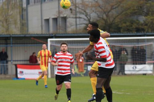 Kingstonians Ismail Yakubu challenges Kezie Ibe (yellow)