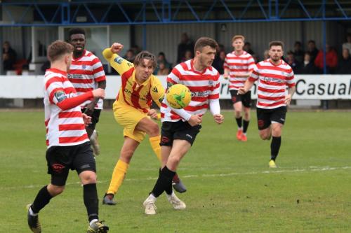 Kingstonians James O Halloran (white boots) blocks Sam Youngss shot