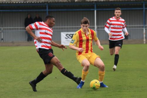 Kingstonians Jonathan Muleba (L) and Enfields Josh Davison