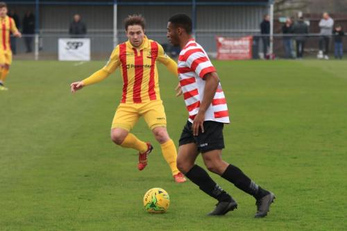 Kingstonians Jonathan Muleba (R) and Enfields Lewis Taaffe