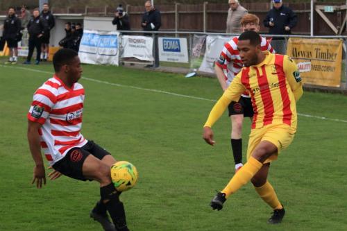 Kingstonians Jonathan Muleba blocks James Mulleys cross