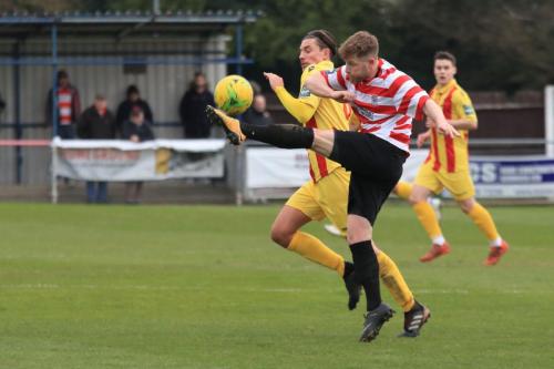 Kingstonians Tom Bird (R) clears from Sam Youngs