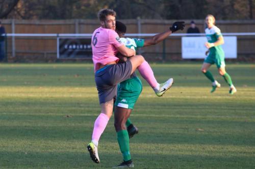 Enfields Dan Rumens (L) challenges Shaun Okojie