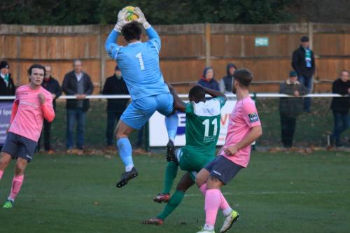 Enfields Joe Wright collects a cross ahead of Travis Gregory (11)