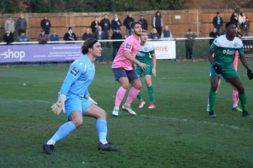 Enfields Joe Wright prepares to deal with  a cross
