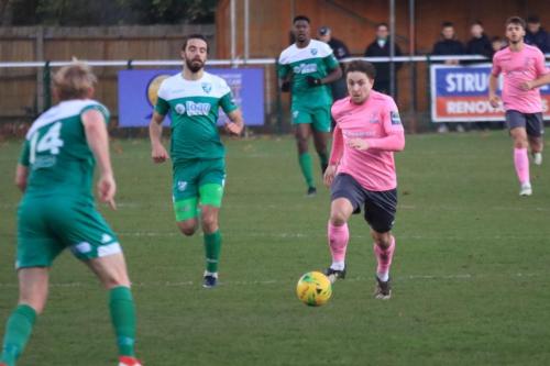 Enfields Lewis Taaffe runs at Charlie Wassmer (14) pursued by Dan Gallagher