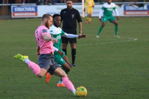 Enfields Sam Hatton (L)clears from DSean Theobalds