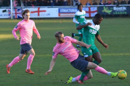 Enfields Sam Hatton tackles Traavis Gregory with Sam Chaney in support