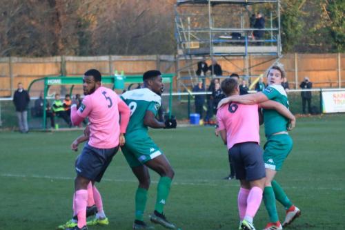 L-r  Taofiq Olomowewe (Enfield), Shaun Okojie, Dan Rumens and Charlie Wassmer tussle for position at a set piece