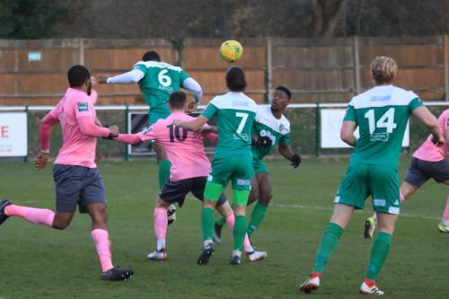 Leatherheads Jerry Nnamani (6) heads clear at a corner