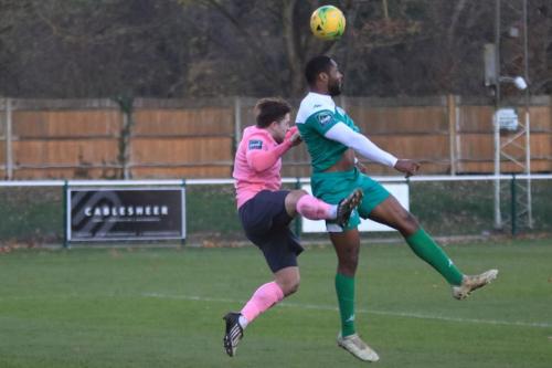 Leatherheads Jerry Nnamani (R) heads clear from Lewis Taaffe