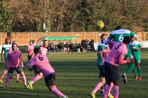 Leatherheads Jerry Nnamani heads across the Enfield box