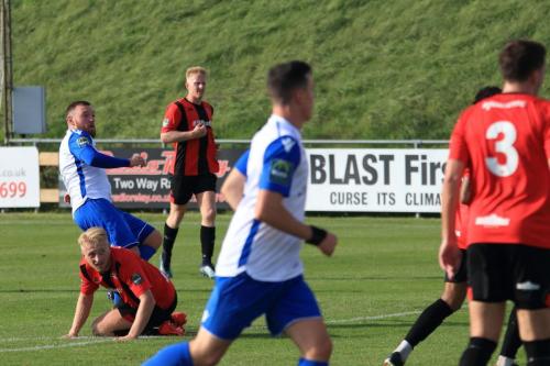 Billy Bricknell (L) scores his second goal and secures Enfield a point after being 2-0 behind