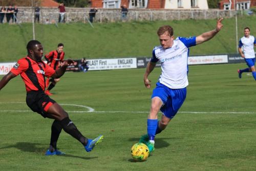 Enfields Aaron Greene (R) avoids the challenge of Michael Dome-Bemwin
